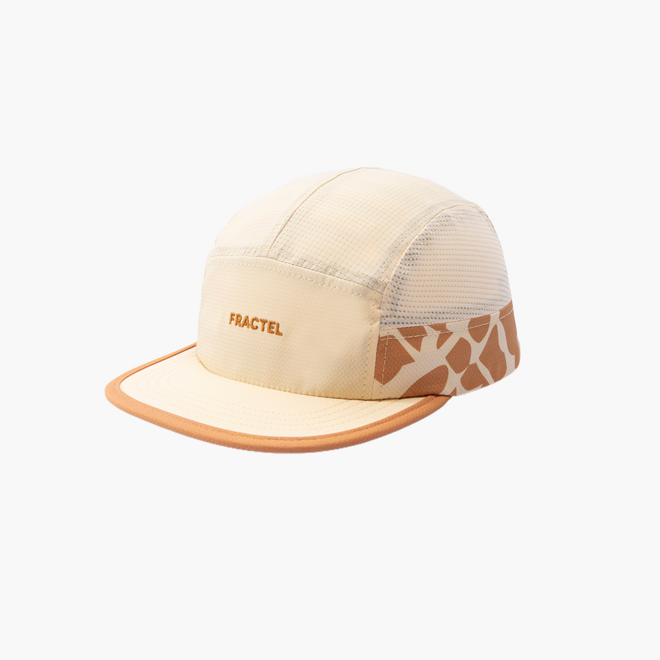 Beige cap with mesh back and giraffe pattern on visor against a white background