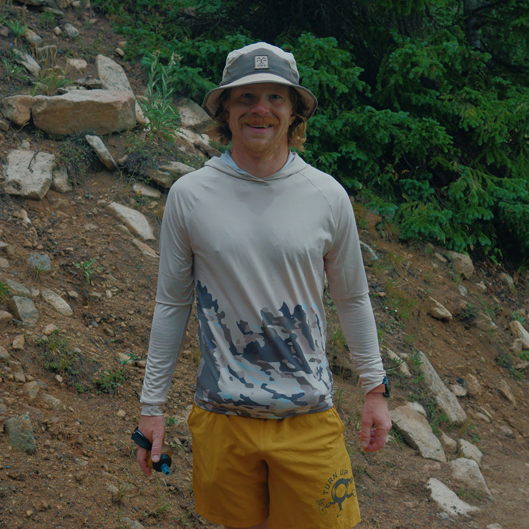 Runner wearing the Fractel S-ROCKIES Adventure Shirt - Limited Edition