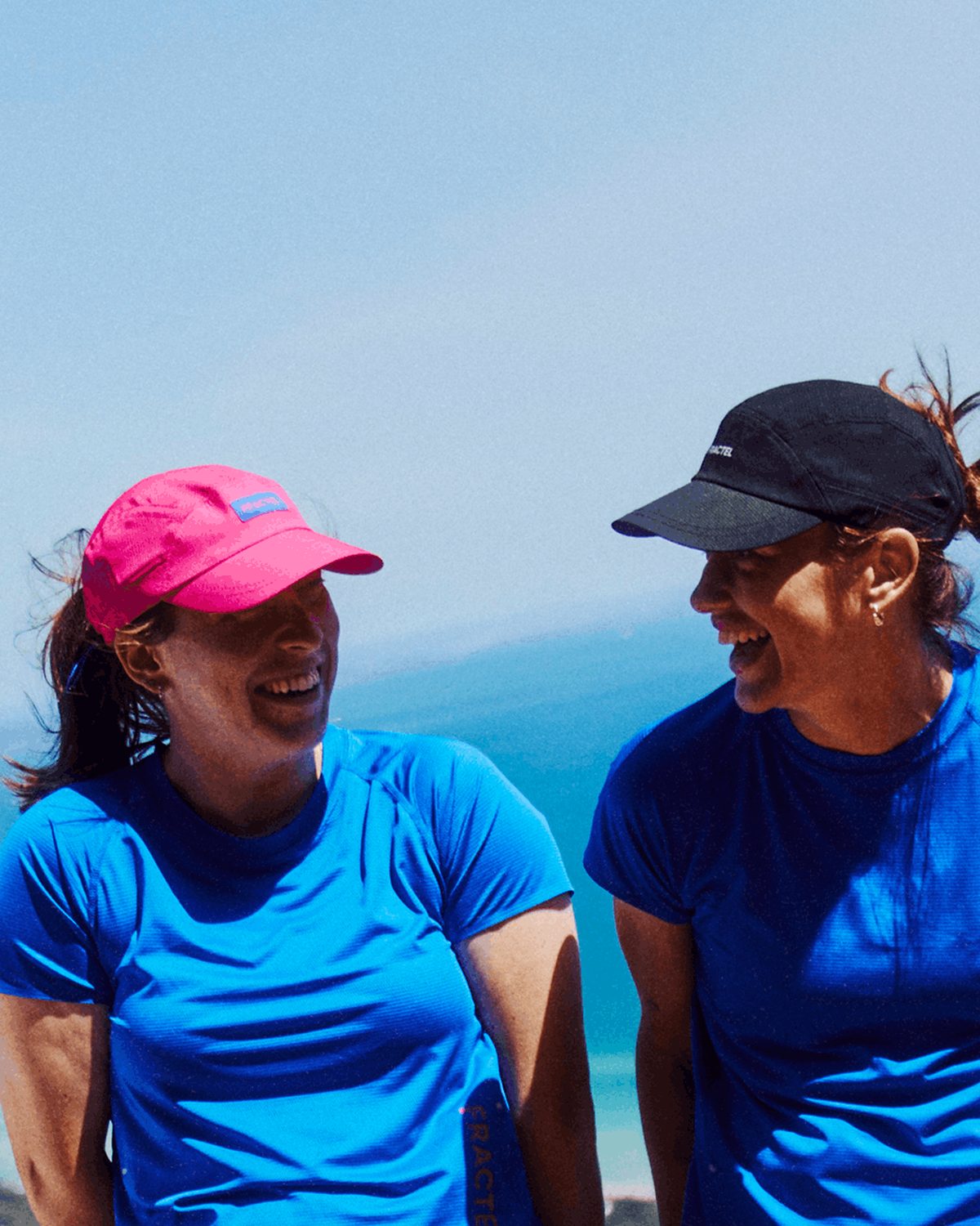 Mens and womens running caps: friends in white, pink, black and blue Fractel caps