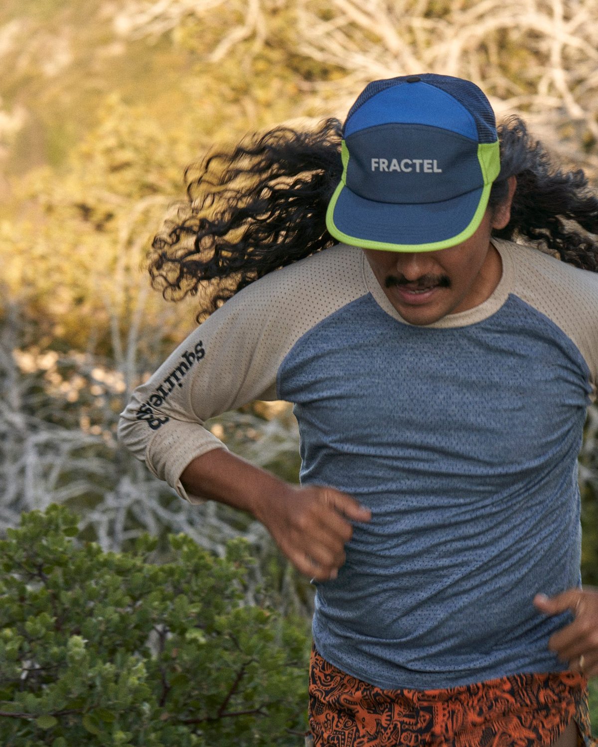 Seasonal trucker hat in blue with neon yellow trim